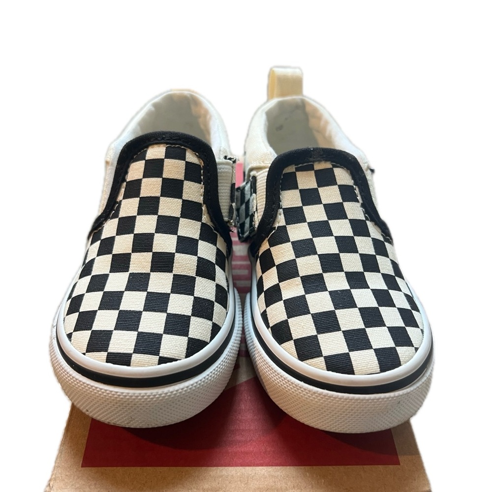Vans Black and White Classic Slip-On Sneakers